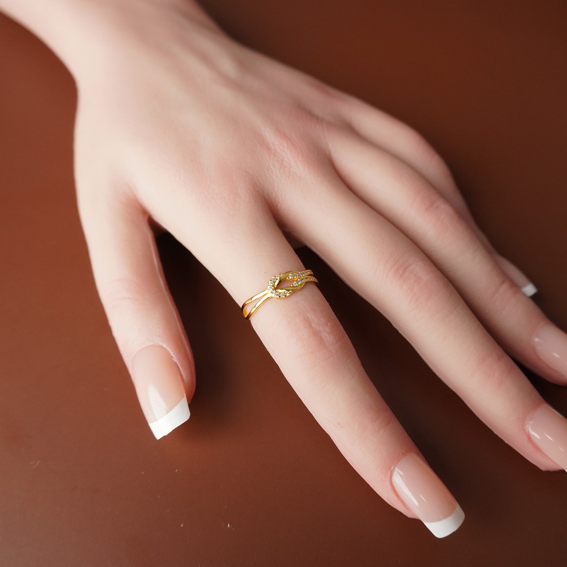 To My Grand Daughter - Bound by Love Hand Knot Ring With Zirconia Stones