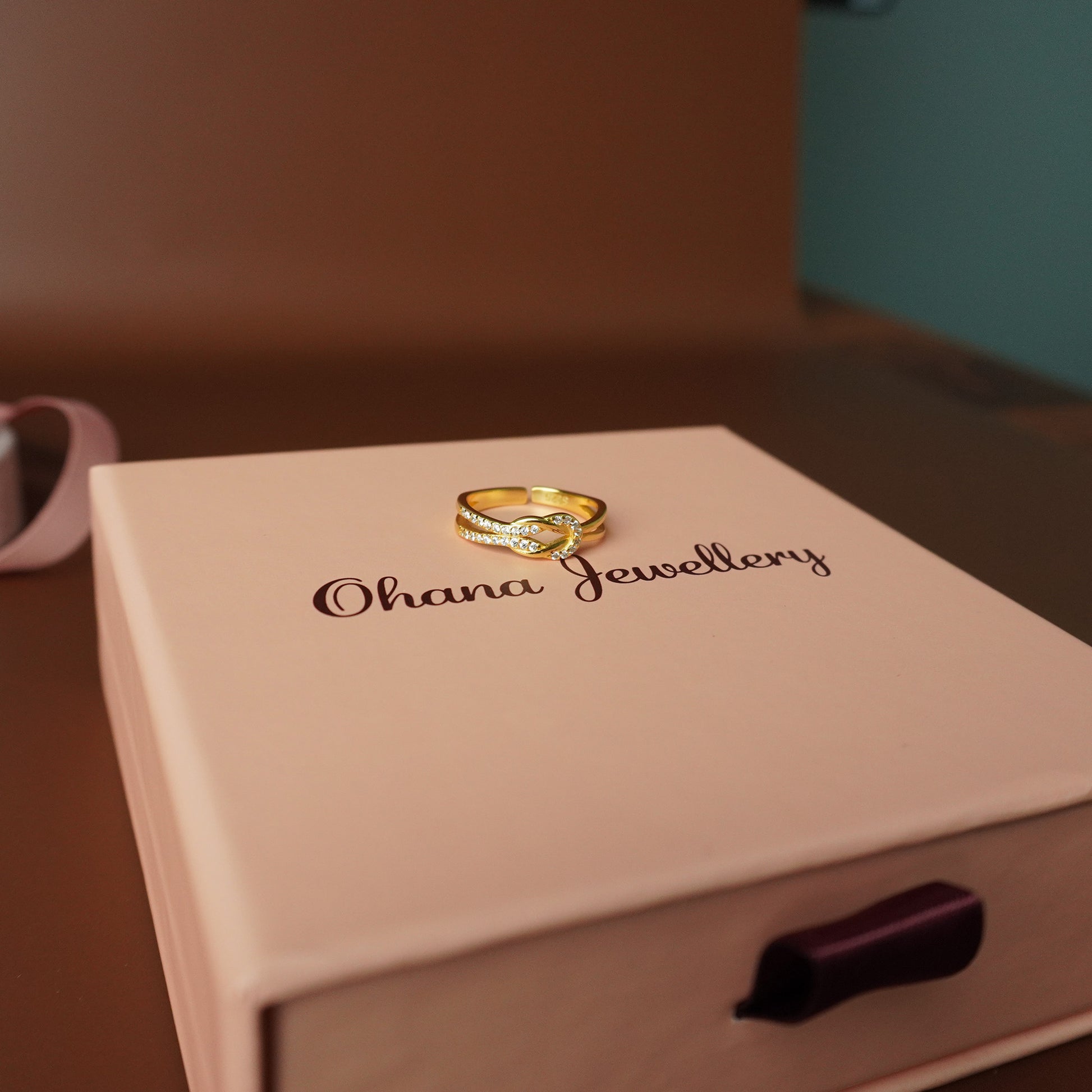 To My Grand Daughter - Bound by Love Hand Knot Ring With Zirconia Stones