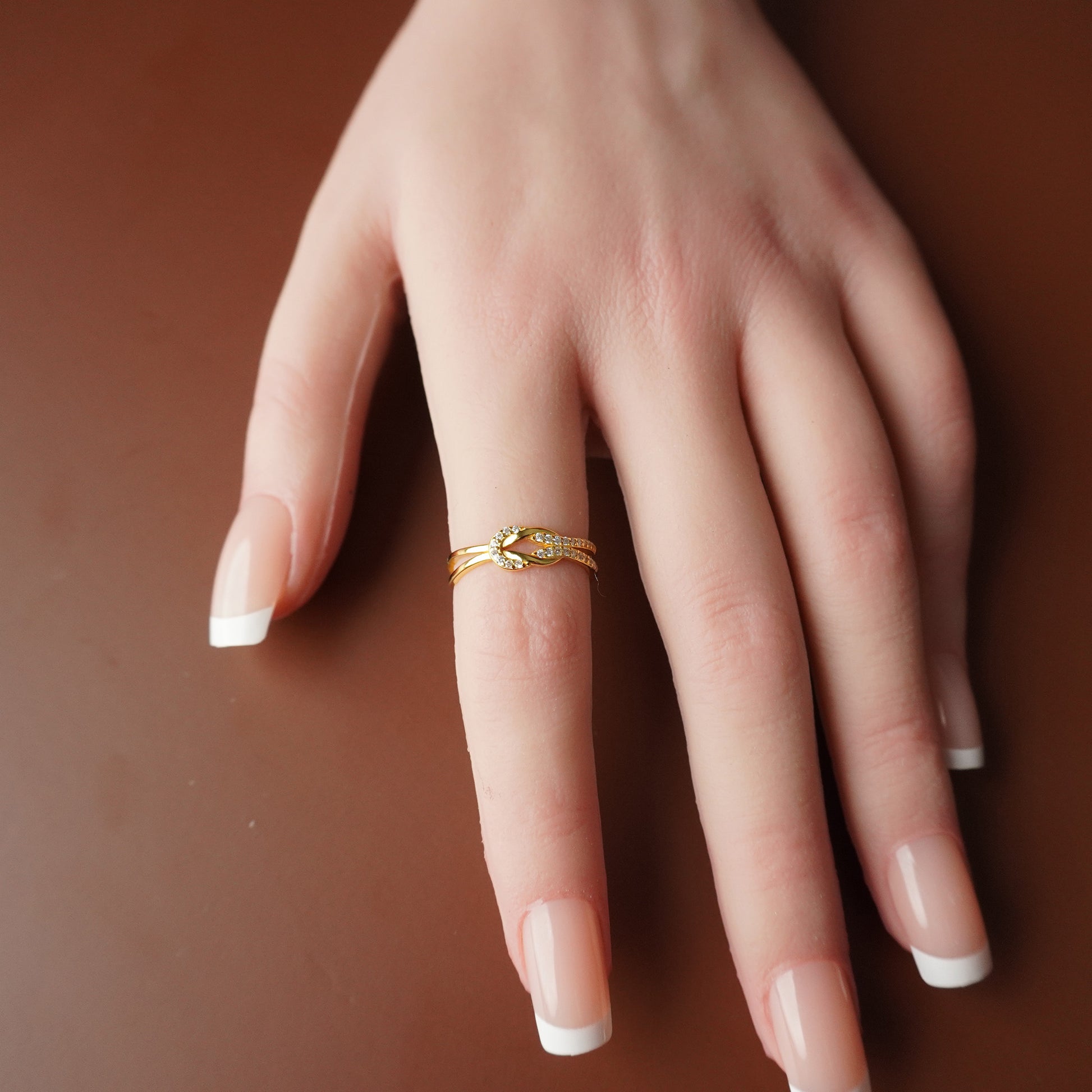 To My Grand Daughter - Bound by Love Hand Knot Ring With Zirconia Stones