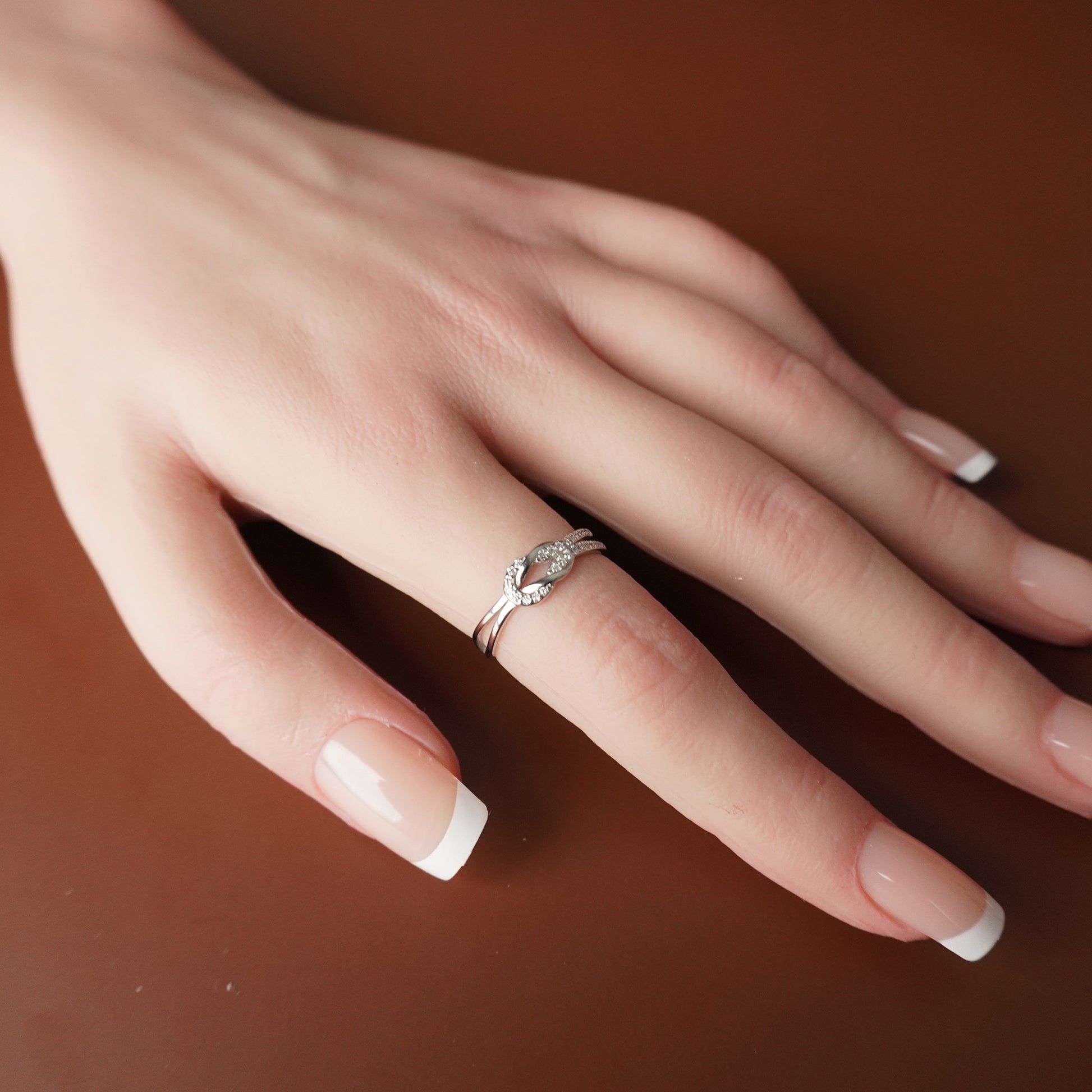 To My Grand Daughter - Bound by Love Hand Knot Ring With Zirconia Stones