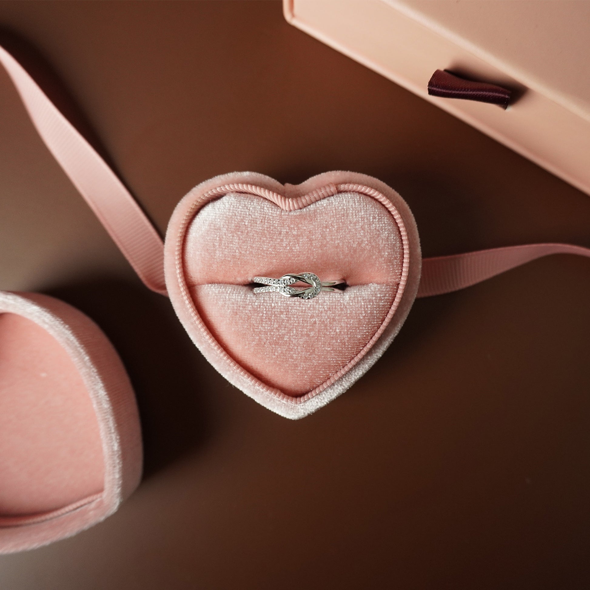 To My Grand Daughter - Bound by Love Hand Knot Ring With Zirconia Stones
