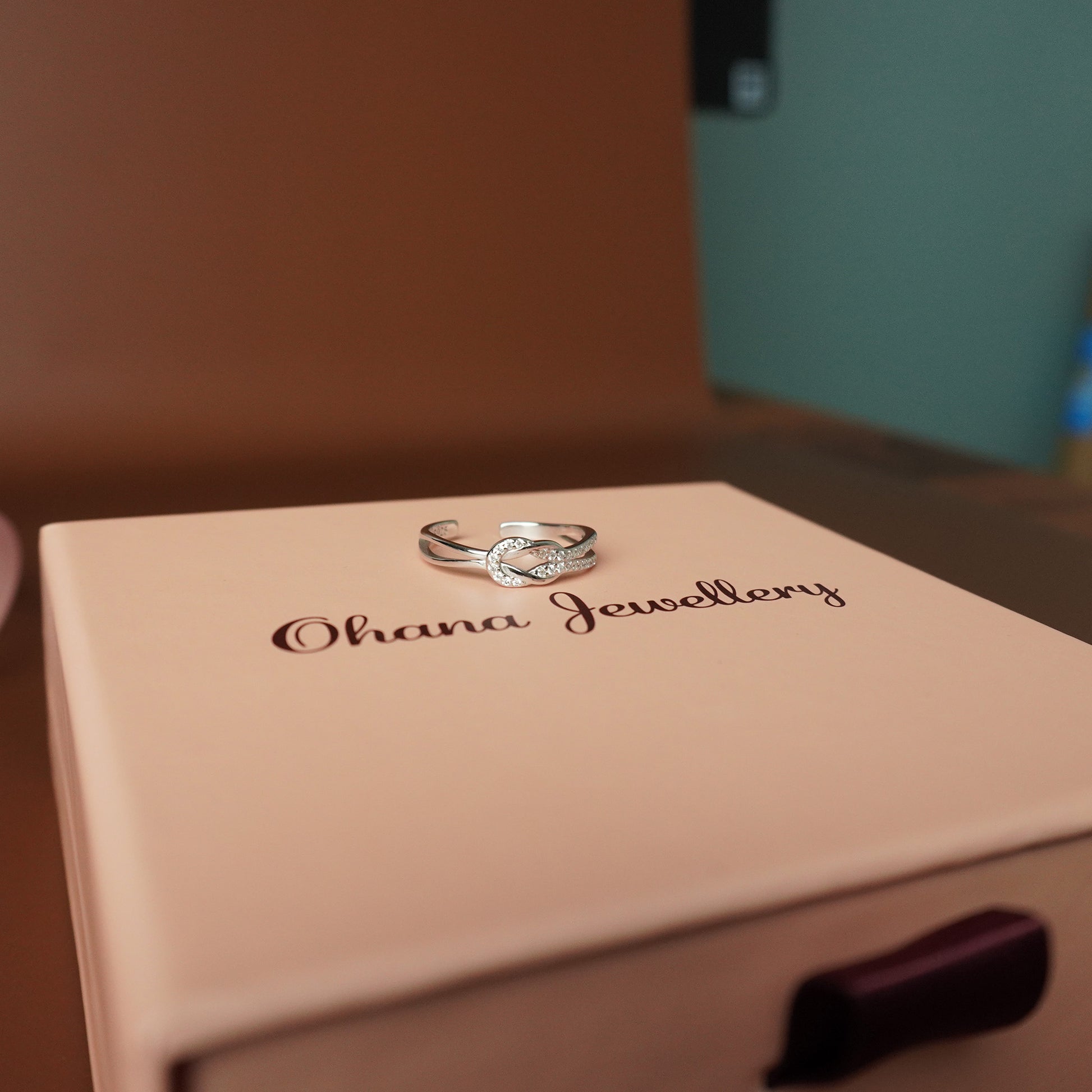 To My Grand Daughter - Bound by Love Hand Knot Ring With Zirconia Stones