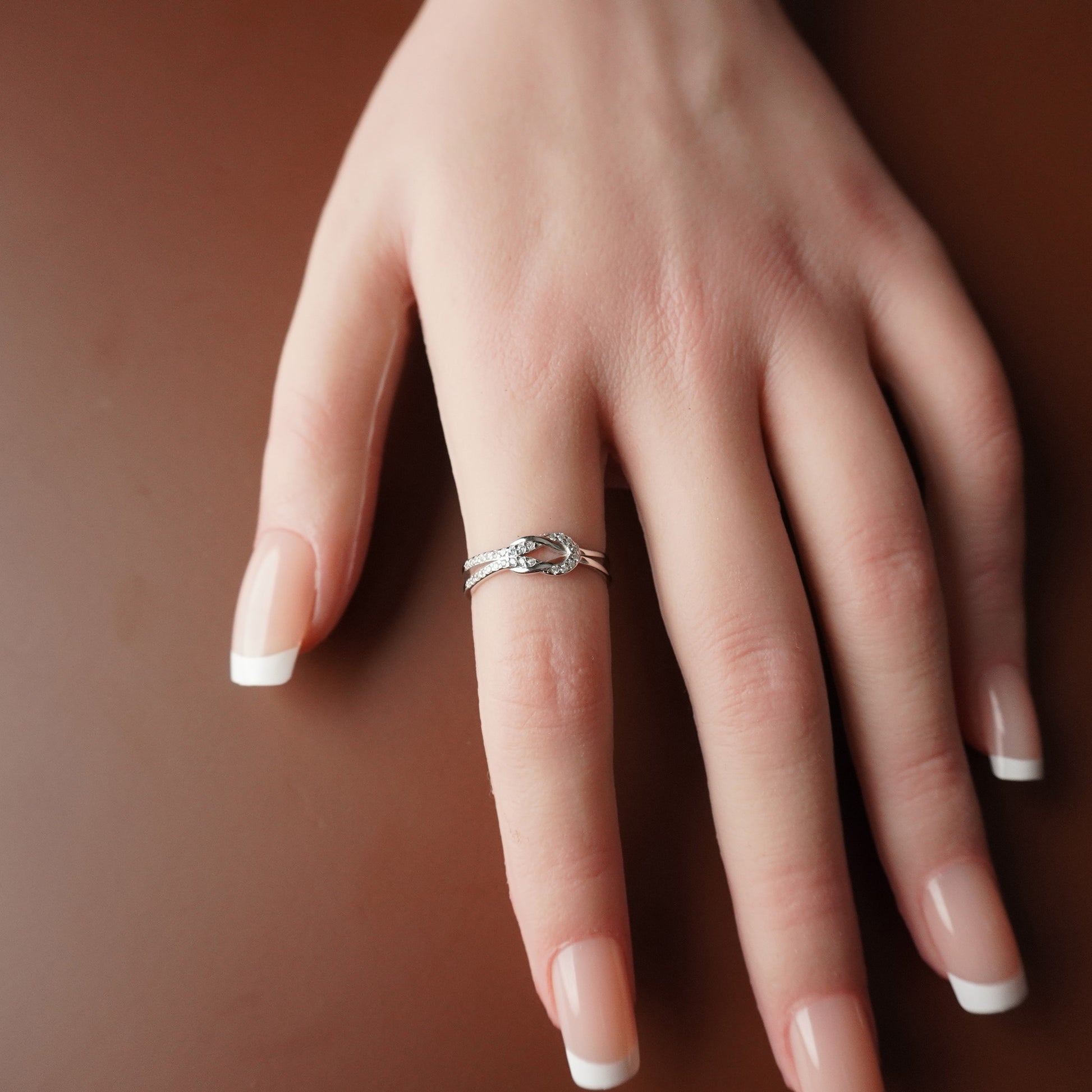 To My Grand Daughter - Bound by Love Hand Knot Ring With Zirconia Stones